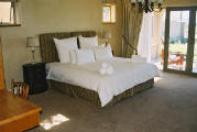 Ground floor bedroom opening onto private patio and garden 